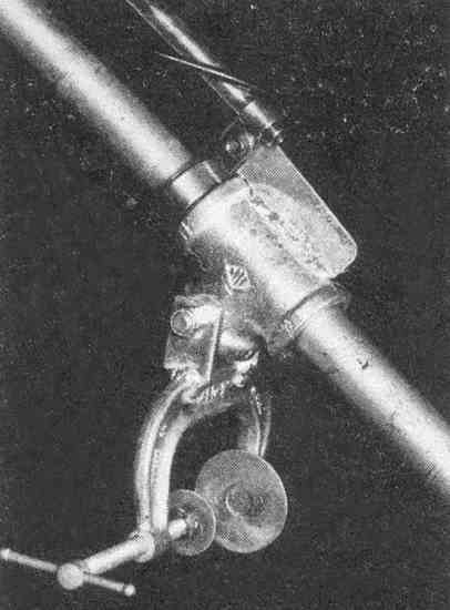 A C-clamp secures the motor to the side of the canoe.